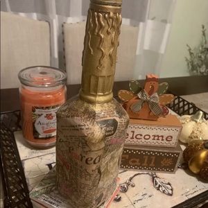 Hand decorated empty glass bottle